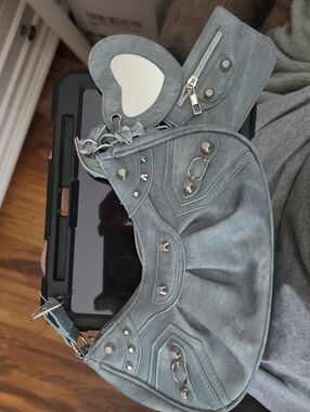 Small light denim shoulder bag with stud accents